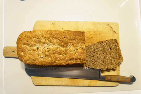 Top view of bread with butter on white table