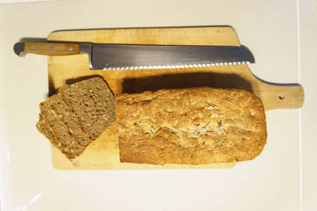 Top view of bread with butter on white table