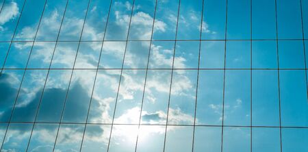 Reflection of a cloudy sky in glass wall of an office building
Image ID: 12995866の写真素材
