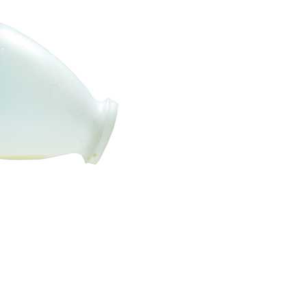 empty fresh milk Bottle with black cap on background.の写真素材