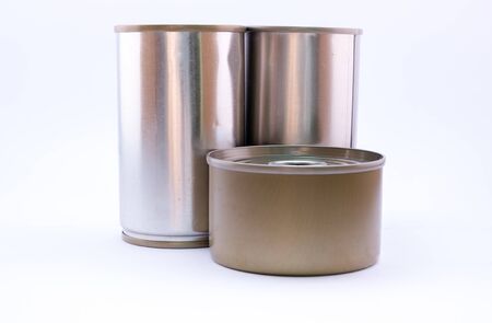 closed tin and long can with open key on white backgroundの写真素材