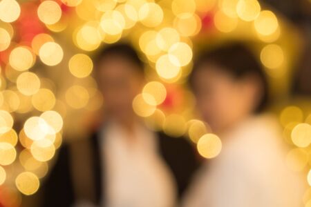 defocused women in front of bokeh backgroundの写真素材