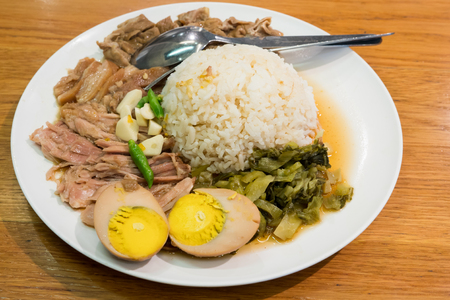 stew pork leg on rice with egg,fresh ham on riceの写真素材