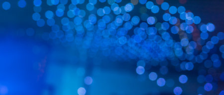 Abstract circular bokeh background, defocused bokeh lights on blue backgroundの写真素材