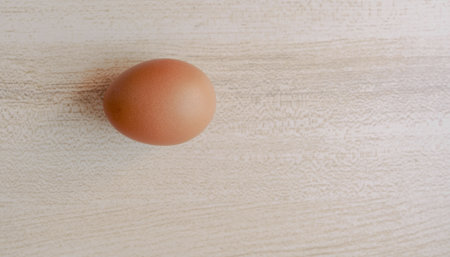 Eggs on a wooden background. Top view, copy space