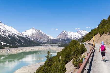 hydroelectric site on Alps with dam and artificial lake