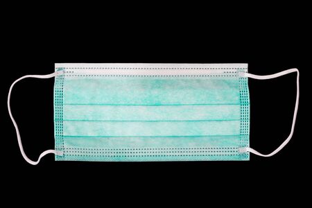 Surgical mask on a black backgroundの写真素材