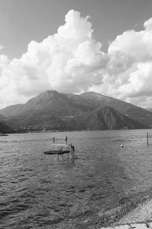 Bellagio, Italy - 13 August 2013: group of people dive from a trampoline in the lake of Como in Bellagioのeditorial素材