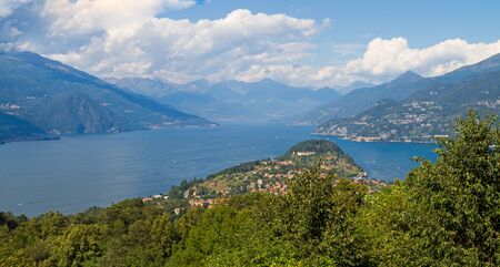 A view of a large body of water with a mountain in the backgroundの写真素材