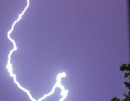 lighting bolt in the sky during a thunderstormの写真素材