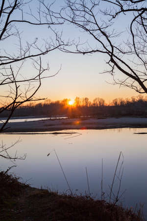 Sunset on a river in winter time. High quality photoの写真素材