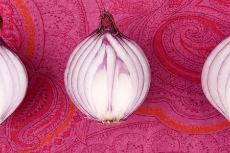 sliced onion on on colourful patterned cloth