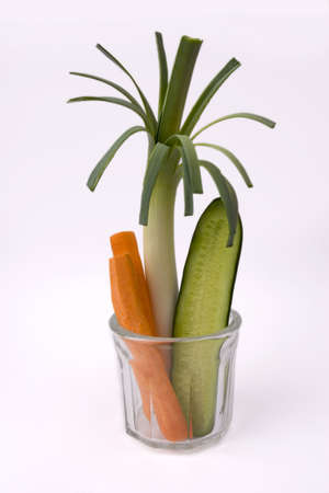 carrot cucumber and leek in glass potの写真素材