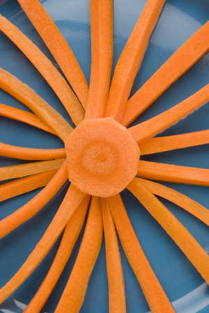 radiant carrot on plate close upの写真素材