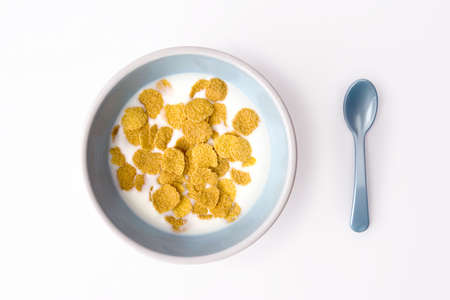 plate of breakfast cereal and spoonの写真素材