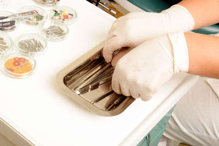 dentist grabbing tools