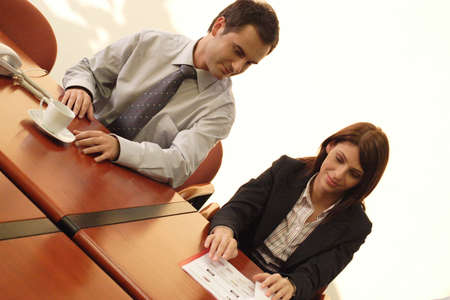 man and woman talking at the informal meeting