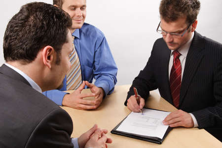Three businessmen handling negotiations.