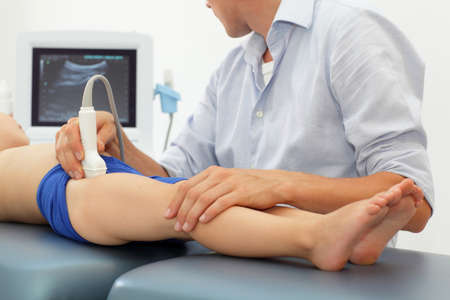 Ultrasound of child's hip joint - diagnosisの写真素材