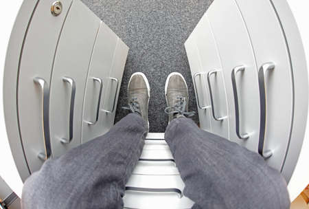 sitting on office filing cabinet -  fish eye lens,first person viewの写真素材