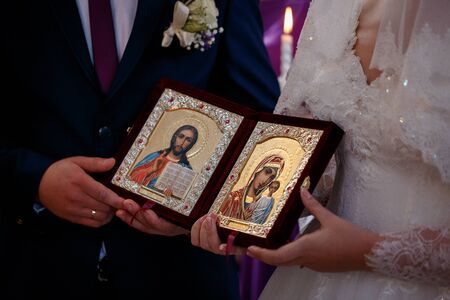 pair holds two icons with a picture saintsの写真素材