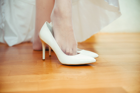 Bride wearing wedding shoesの写真素材