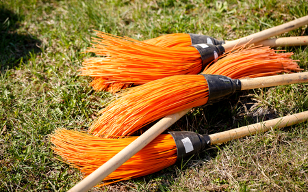 pink brooms for cleaning streets