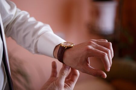 groom wears a watchの写真素材