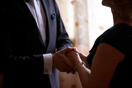 mother and son holding hands