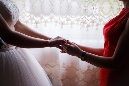 mother and daughter holding handsの写真素材