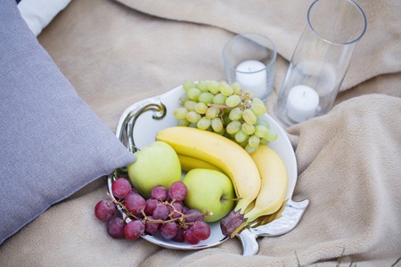 plate of fruit for a romantic date on natureの写真素材
