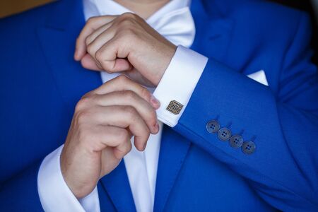 a man wearing a blue jacket and white shirt for the weddingの写真素材