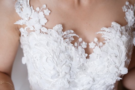 beautiful bride dress decorated with beads and lace