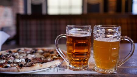 beer and pizza in a brasserieの写真素材