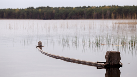 submerged boat on a lakeの写真素材
