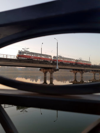 High-speed tram cars move on the bridge. High-speed tram. Tram on the bridge.の写真素材