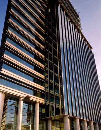 Modern office building against blue sky