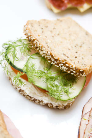 cucumber ,tomato ,rosemary and cheese sandwich still life whith blurry backgroundの写真素材