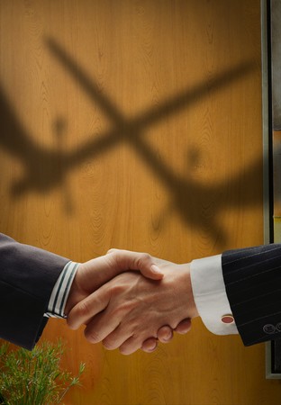 business handshake with shadows behind showing  real intentionの写真素材