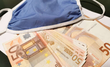medical mask on euro paper moneyの写真素材