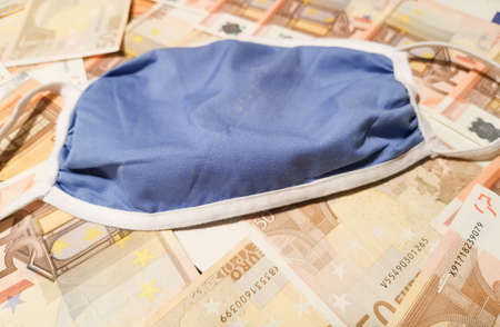face mask protection on paper moneyの写真素材