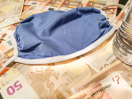 Medical mask protection on banknotesの写真素材