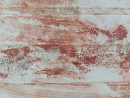 abstract red paint on metal surfaceの写真素材