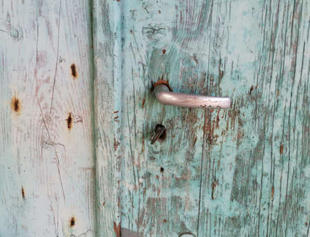 Old door with handle and lockの写真素材