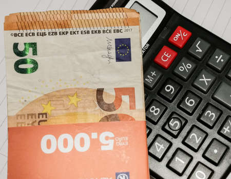 euro banknotes and calculatorの写真素材