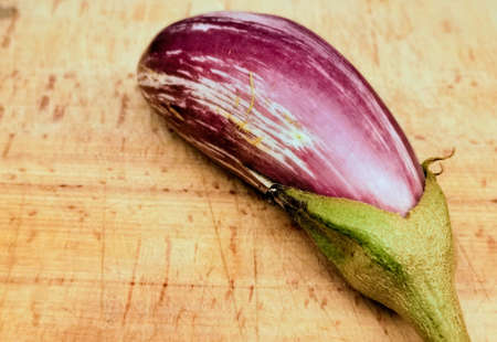 Eggplant on wooden tableの写真素材