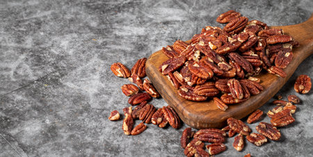 Pecan on dark background. healthy fat. Heap shelled Pecans nut. close up. keto diet Studio shoot....