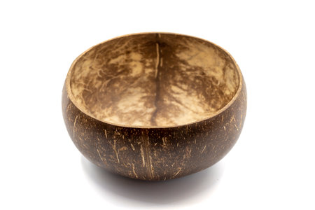 Empty coconut bowl on a white background. Bowls made from coconut shell.の写真素材
