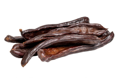 Carob isolated on a white background. healthy food. close upの写真素材