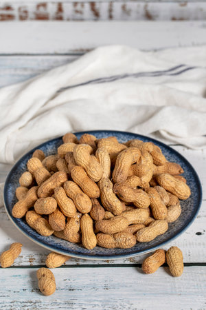 Peanut in shell on wooden background. healthy food.